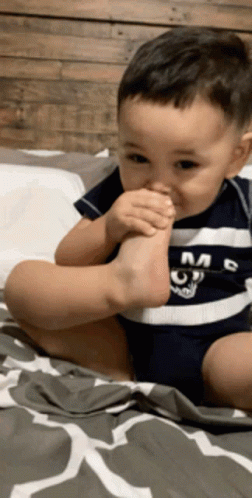 Baby Smelling Own Stinky Foot GIF