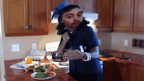 Man In Blue Stirring The Pot GIF