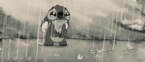 Stitch From Disney 'S Lilo And Stitch Is Crying In The Rain In A Black And White Photo . GIF
