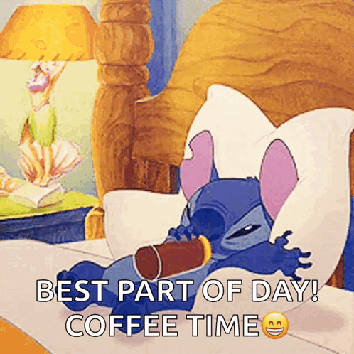 Stitch Is Laying In Bed With A Cup Of Coffee GIF