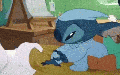 Stitch Laying on Bed Wearing Nightcap