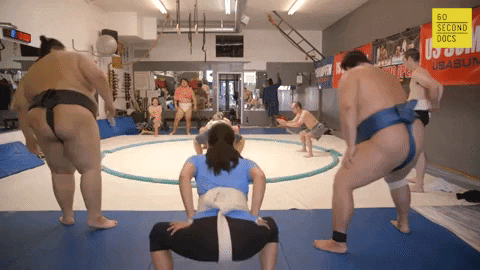 Stomping Legs Stretching Sumo Wrestlers GIF