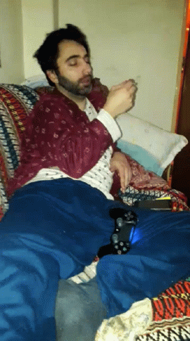 Stoned Guy Lying On Couch GIF