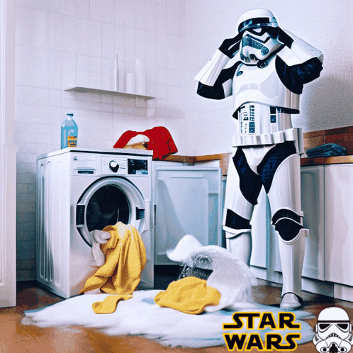 Storm Trooper Standing In Front Of A Washing Machine With Star Wars Written On The Bottom Right GIF