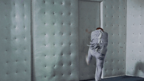 Straight Jacket Trying To Escape The Room GIF