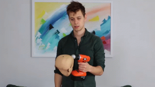 Stressed Guy Holding Black Decker Drill GIF