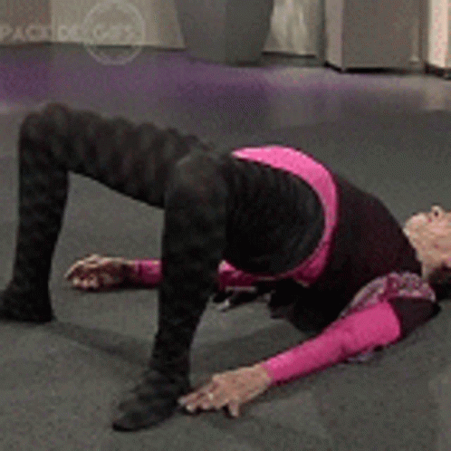 Grandma Back Stretch On Floor GIF