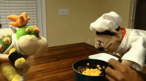 Stuffed Animal Chef Hat Looking At Pot GIF