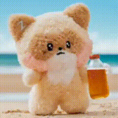 Stuffed Animal Holding Beer on Beach