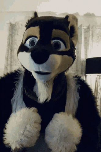 Stuffed Animal in Black and White Furry Outfit