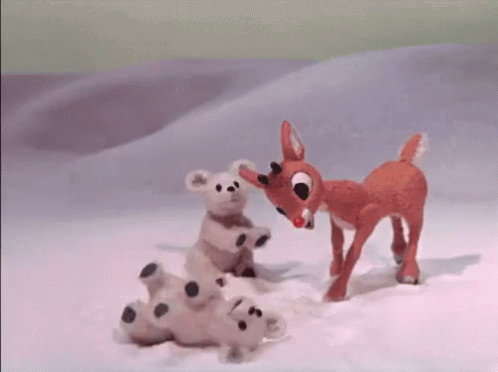 Stuffed Animal Standing Next To Stuffed Animal Laying In Snow GIF