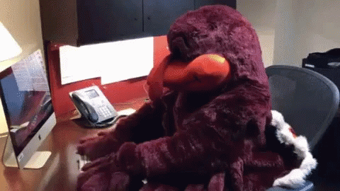 Stuffed Animal Talking on Telephone Desk