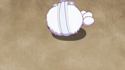 Stuffed Animal With Bandage Around Head Laying on Ground