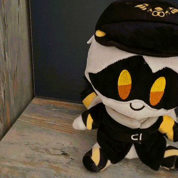 Stuffed Animal With Black Hat and Belt With CI