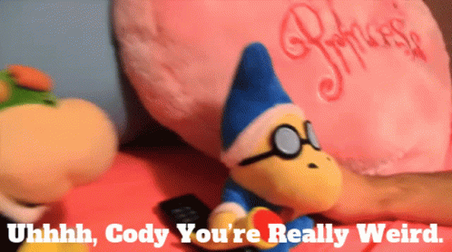 Stuffed Animal with Glasses Next to Princess Pillow
