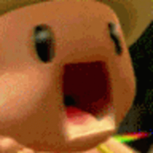 Stuffed Animal With Rainbow in Mouth