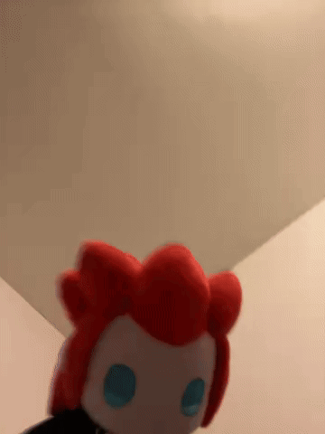 Stuffed Animal With Red Hair And Blue Eyes GIF