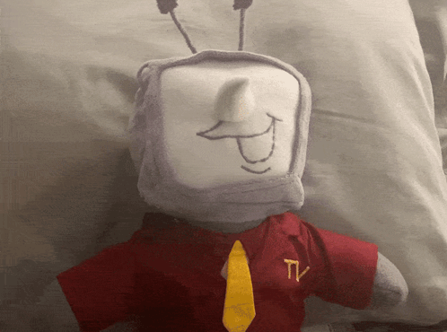 Stuffed Animal With TV Logo On Shirt And Tie GIF