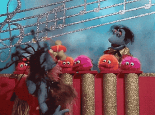 Stuffed Animals On Podium, One With Dreadlocks GIF
