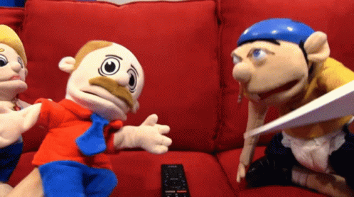Stuffed Animals Sitting on Red Couch Remote Control