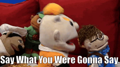 Stuffed Animals Sitting On Red Couch Say What GIF