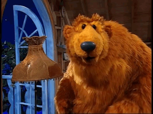 Stuffed Bear Standing Next To Lamp GIF