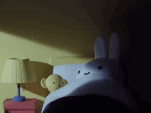 Stuffed Bunny Lying on Bed