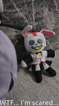 Stuffed Bunny Sitting on Couch Wtf I'm Scared