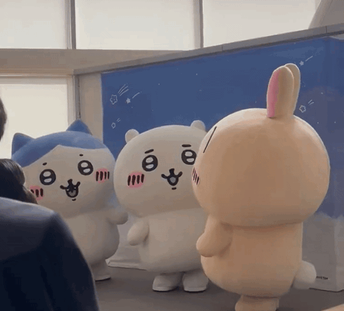 Stuffed Cat And Bunny Standing Together GIF