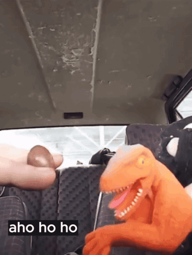 Stuffed Dinosaur In Back Seat Saying Aho Ho Ho GIF