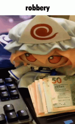 Stuffed Doll Next to Money Pile Saying Robbery