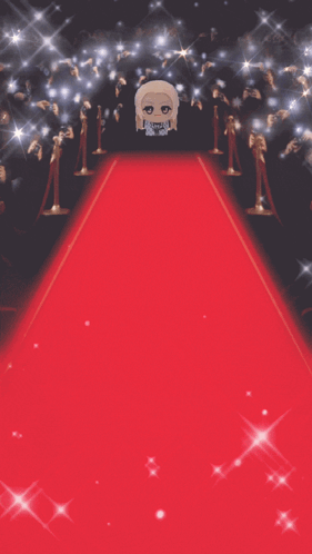 Stuffed Doll Standing on Red Carpet in Front of Crowd