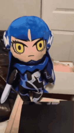 Stuffed Doll With Blue Hair and Yellow Eyes