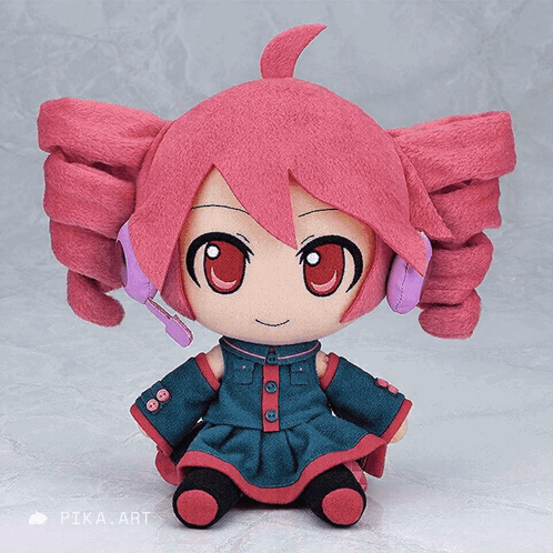 Stuffed Doll With Pink Hair and Headphones