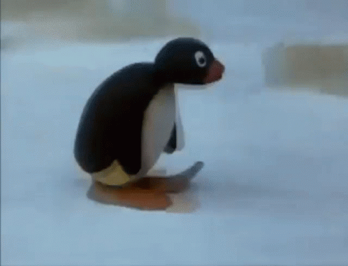 Stuffed Penguin Sitting on Ice