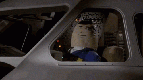 Stuffed Superman Sitting in Car