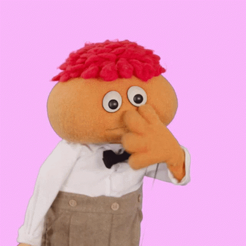 Stuffed Toy With Bow Tie And Red Hair GIF