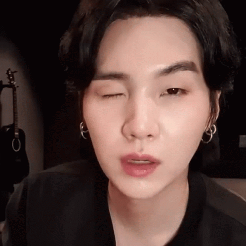 Suga Winking While Raising Eyebrows GIF