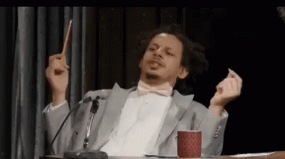 Suit And Bow Tie Man At Microphone With Pencil GIF