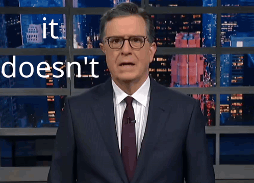 Suit and Tie Man at Wall Saying It Doesn't