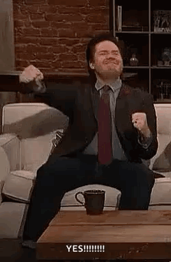 Suit-and-Tie Man Holding Coffee Arms Outstretched