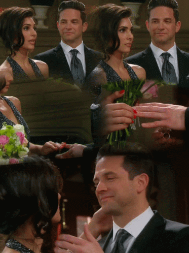 Suit And Tie Man Holding Woman's Hand With Bouquet GIF