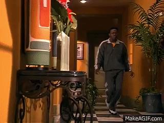 Suit and Tie Man Walks Past Blue Car