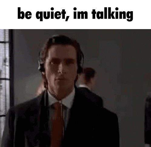 Suit-and-Tie Man With Headphones Be Quiet Im Talking