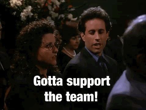 Suited Man And Woman Gotta Support The Team GIF