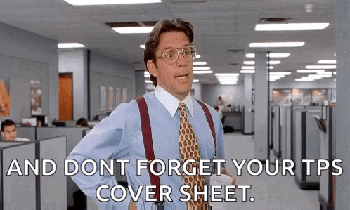 Suited Man Holding Coffee and Cover Sheet