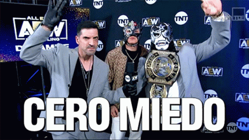 Suited Man Holding Wrestling Championship TNT Logo