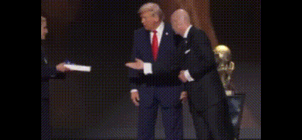 Suited Man Shaking Hands Woman Holding Paper