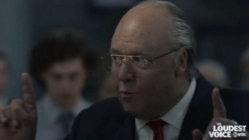 Suited Man With Glasses Says We're Gonna Win