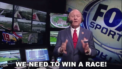 Suited Man with Tie at Fox Sport Sign